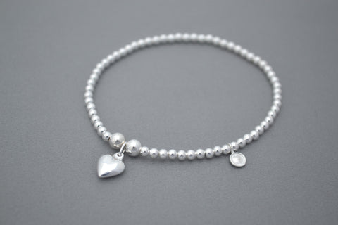 Sterling Silver bead bracelet with pretty small puff heart charm