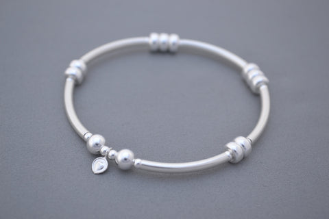 Designed by Alisa Signature Sterling Silver noodle and Silver disc bead bracelet