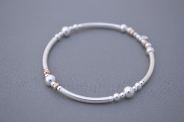 Sterling Silver noodle mixed with Rose Gold and Silver disc bead bracelet