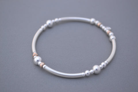 Sterling Silver noodle mixed with Rose Gold and Silver disc bead bracelet