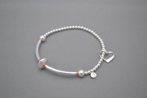 Sterling Silver noodle and small Rose Gold bead bracelet with open heart charm