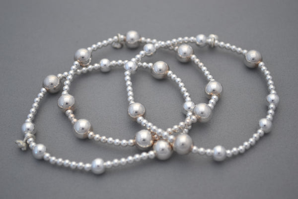 Stack of three Sterling Silver 8mm and 5mm mixed bead bracelets