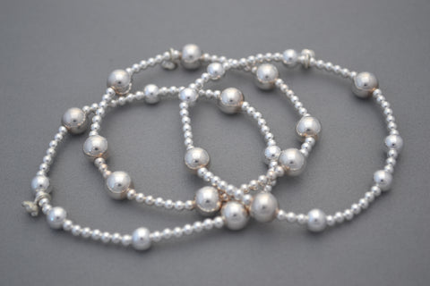 Stack of three Sterling Silver 8mm and 5mm mixed bead bracelets