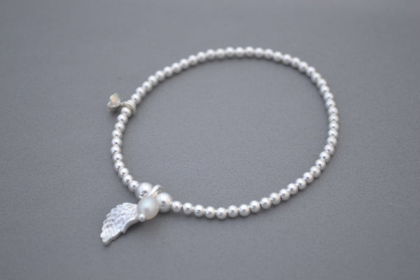 Sterling Silver 5mm and 3mm mixed bead bracelet with Angel wing and pearl charms